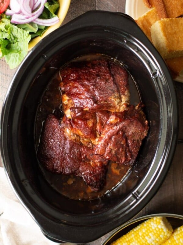 Baby back ribs done cooking in a slow cooker.