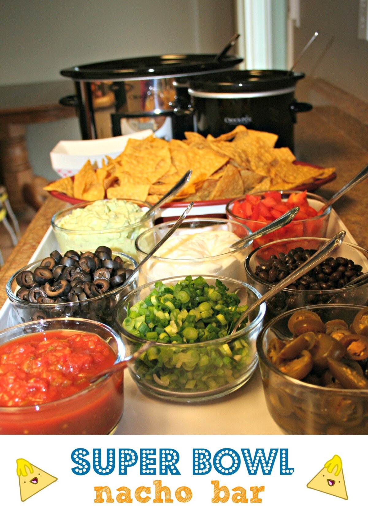 Nacho bar toppings with 2 crockpots in background