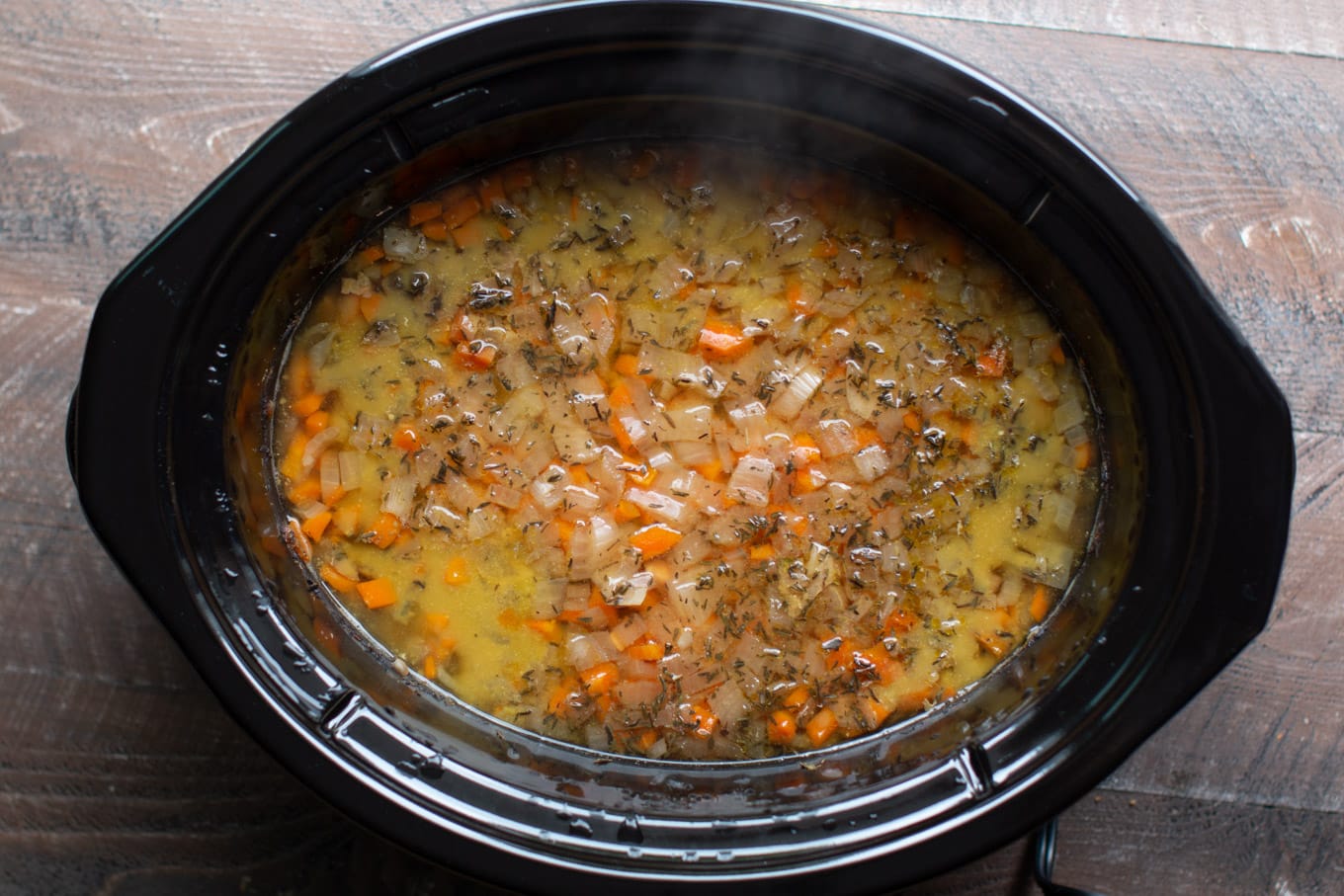 cooked split pea in the slow cooker, not yet stirred.