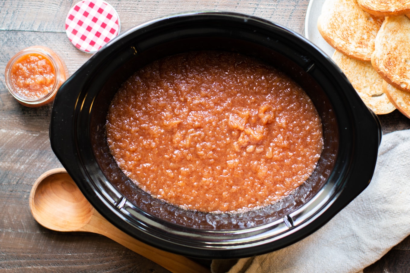 Cooked finished applesauce in a slow cooker.