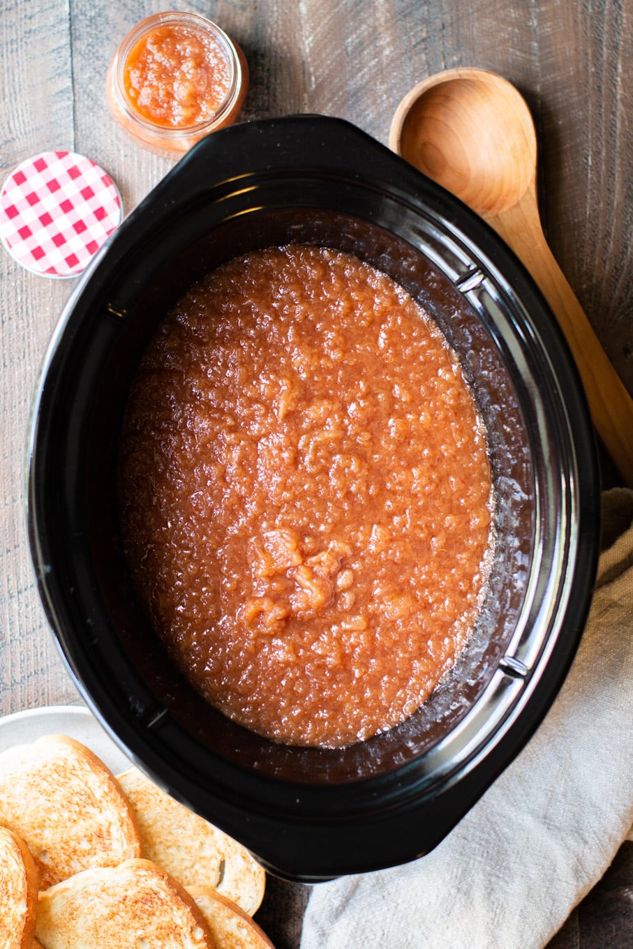 Applesauce in a slow cooker with toast on the side.