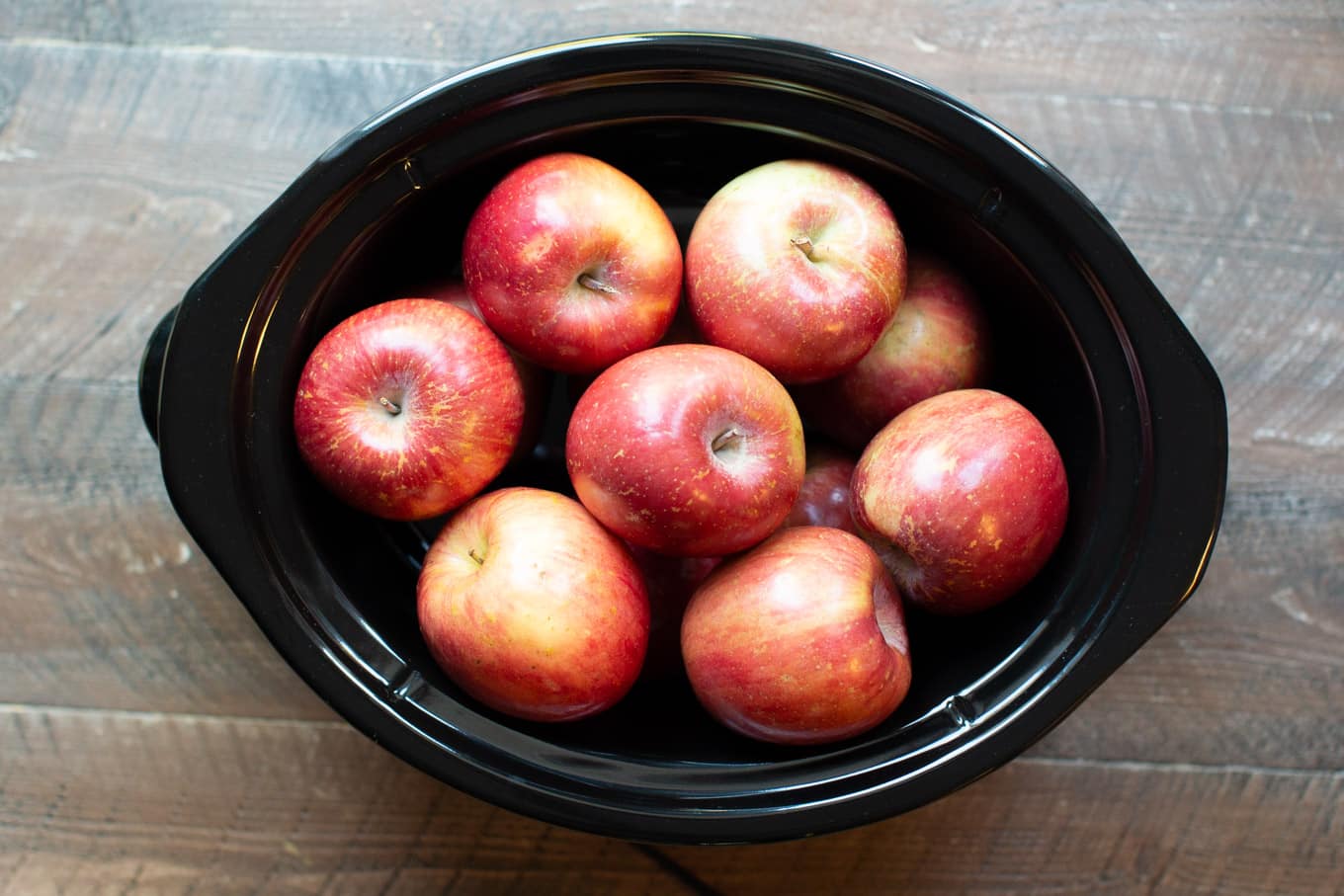 Whole apples in a slow cooker.