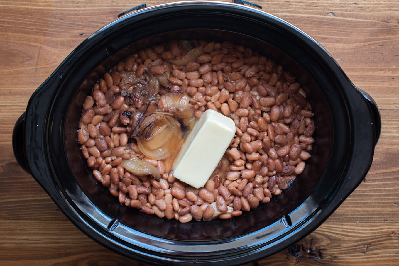 cooked pinto beans that have most of liquid drained off. Stick of butter on top.