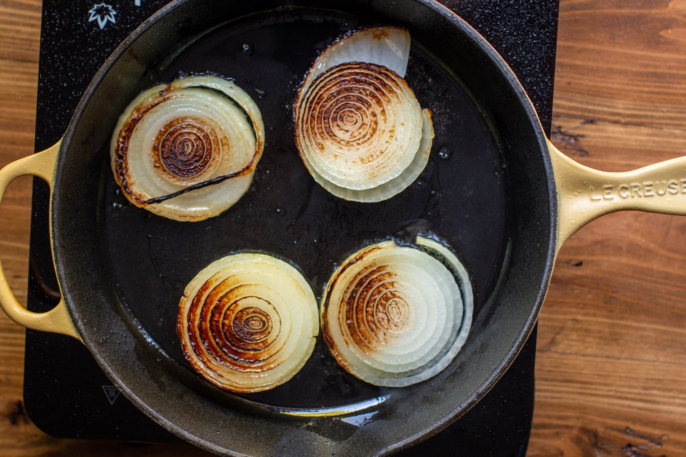 browned yellow onion slice in pan.