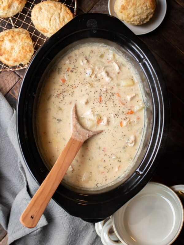 Chicken pot pie filling in a slow cooker.