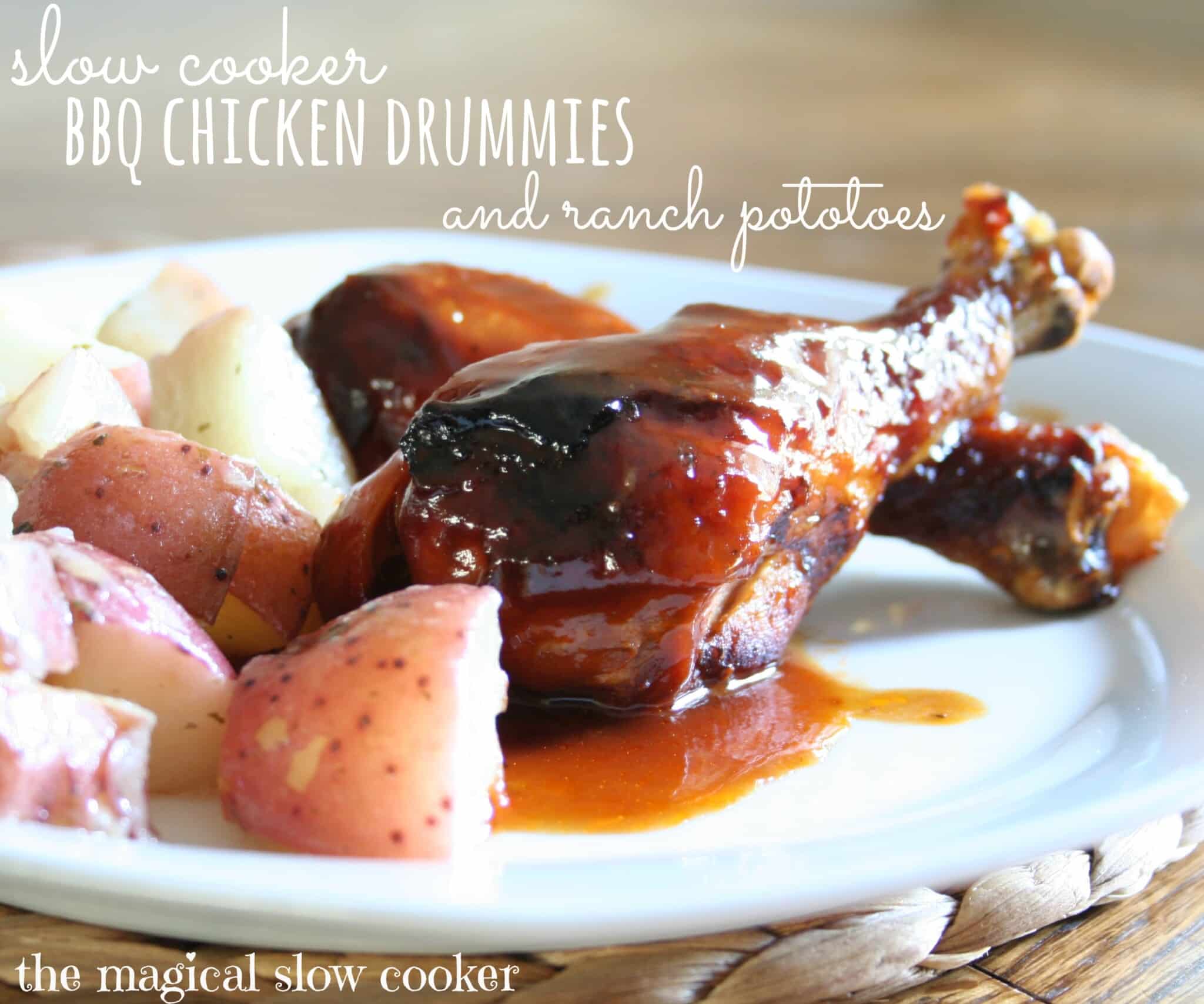 chicken drumsticks and potatoes on white plate