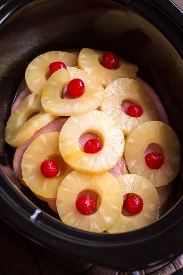 ham steaks with pineapple rings and maraschino cherries.