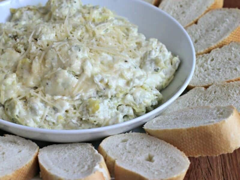 close up of artichoke dip with parmesan on top