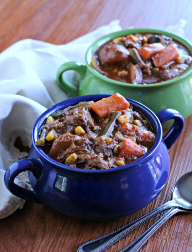 close up of beef stew in blue bowl