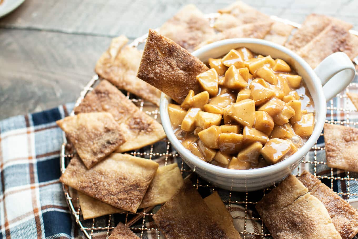 bowl of caramel apples with pie crust strip in it.