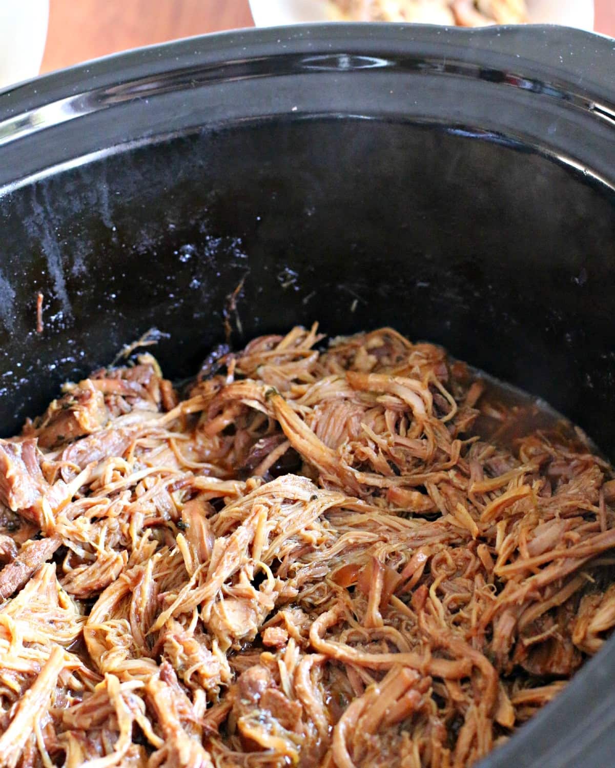 shredded barbecue pulled pork in slow cooker