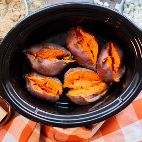 5 sweet potatoes in slow cooker, cooked and slit open