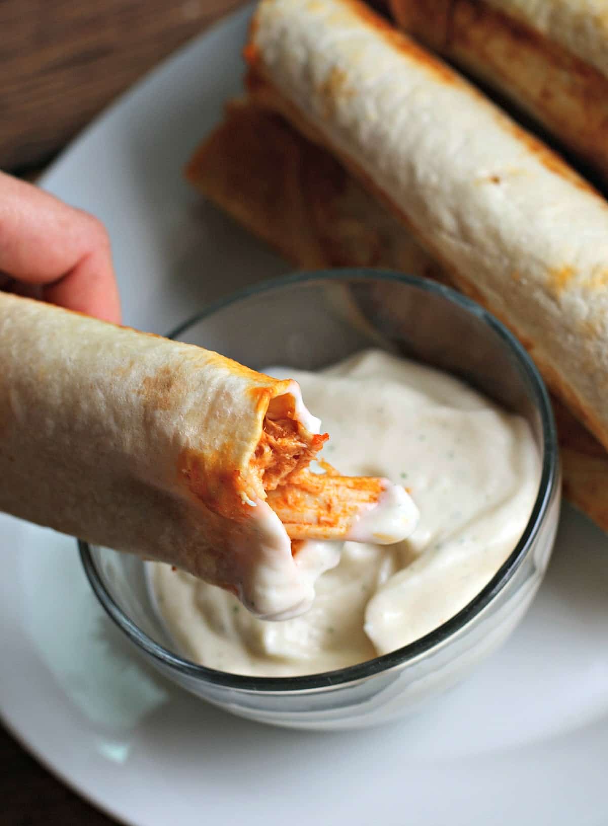 dipping buffalo flauta in ranch dressing