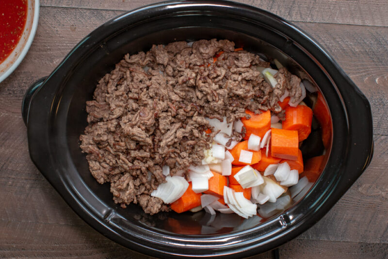 ground beef, carrots and onions in slow cooker