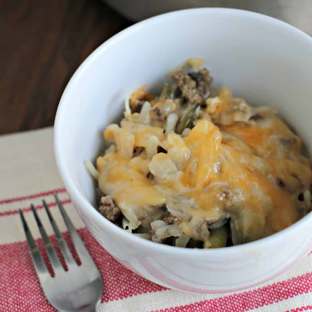 bowl of lightened up tater tot casserole in a white bowl