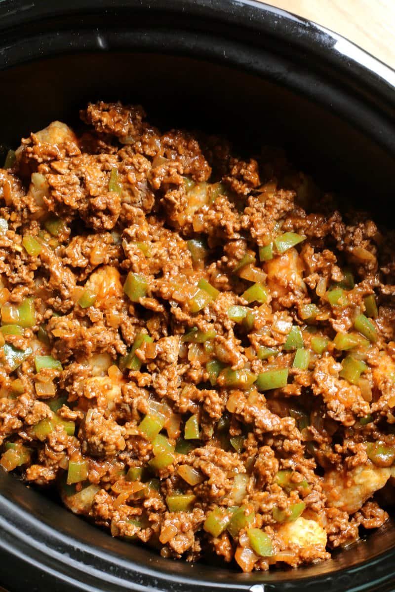 ground beef in slow cooker with taco seasoning, bell pepper and onion.