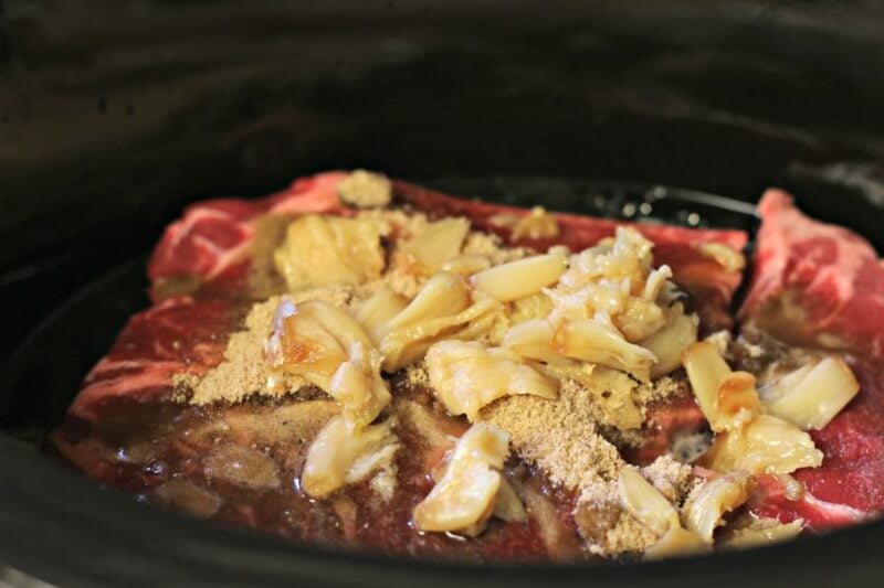 chuck roast with roasted garlic on top.