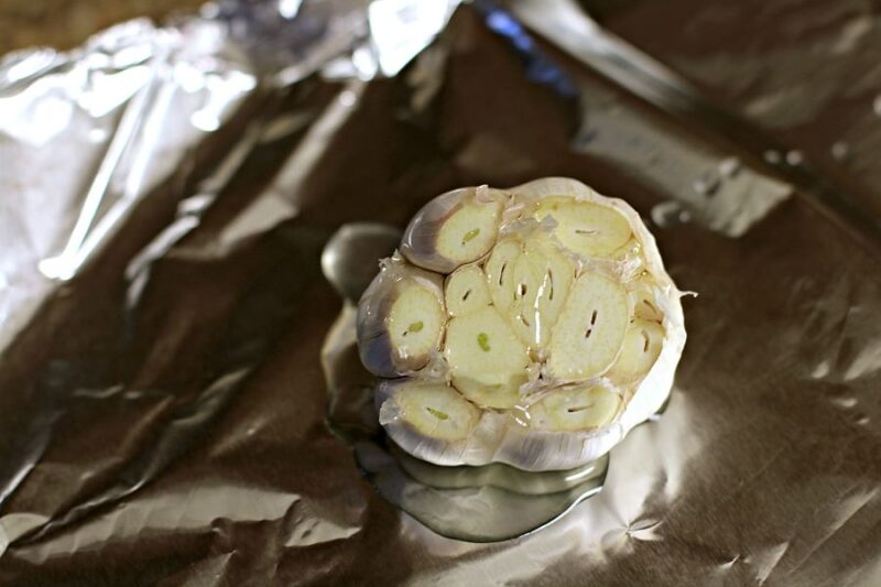 uncooked head of garlic on foil