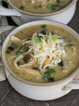 bowl of white chicken chili with cheese on top