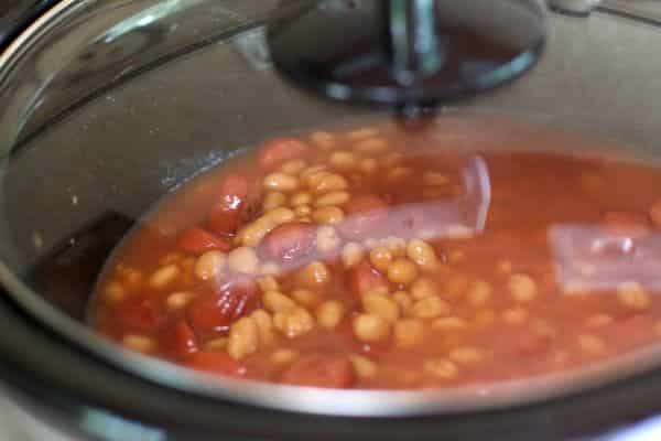 pork and beans and hot dogs with in slow cooker with lid on.