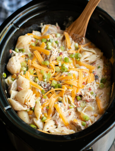 close up of southwestern cheesy chicken pasta in slow cooker