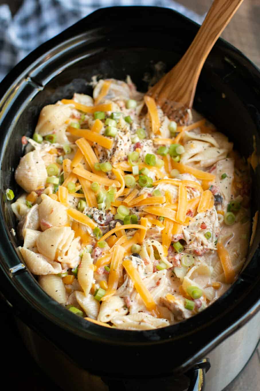 close up of southwestern cheesy chicken pasta in slow cooker