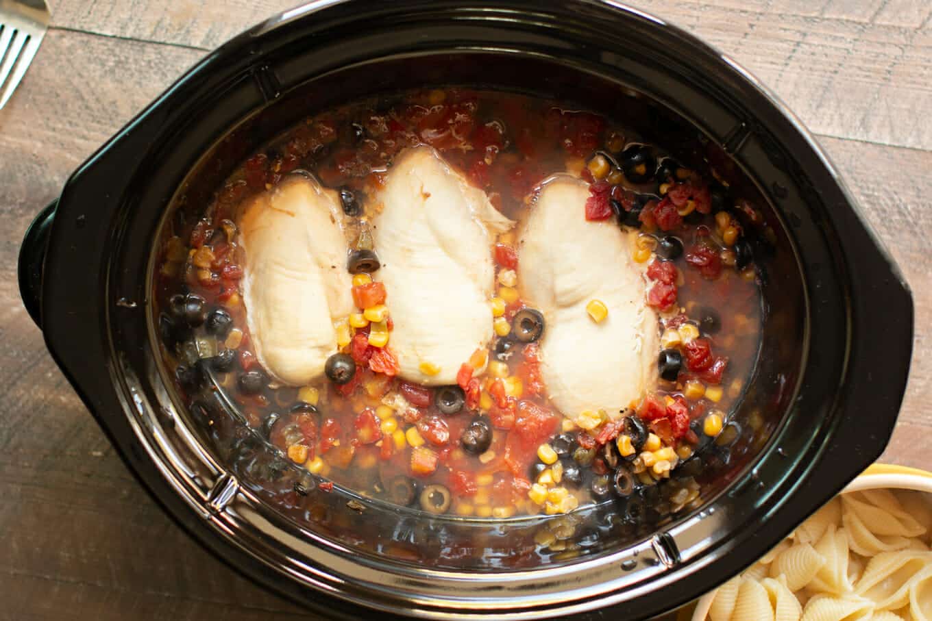 corn, rotel, chicken and olives in slow cooker