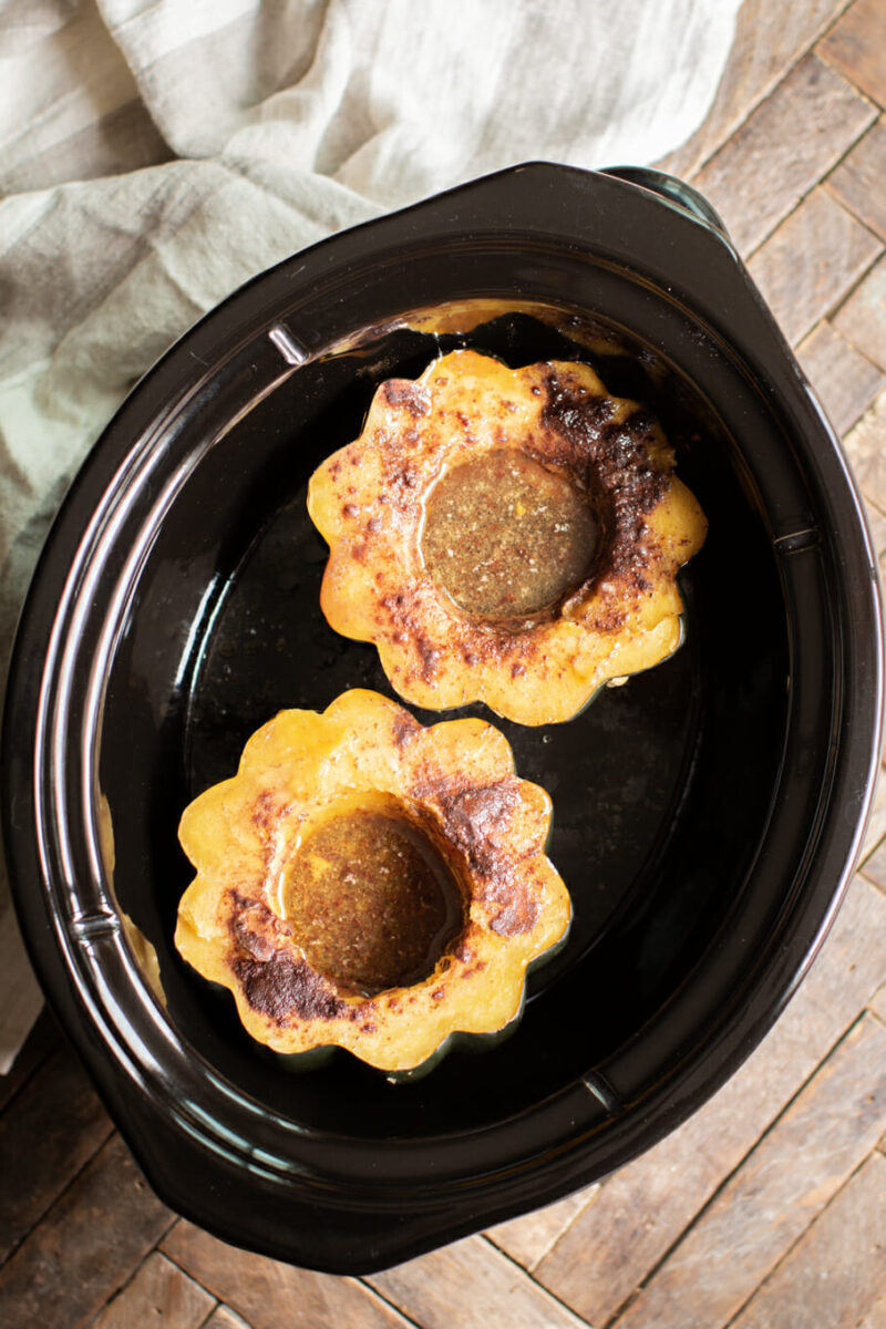 2 halves of cooked acorn squash in slow cooker