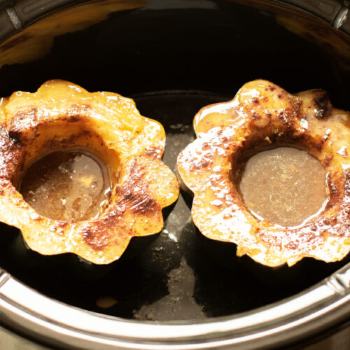 close up of 2 acorn squash cooked in slow cooker