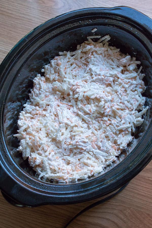 Cheesy hashbrowns uncooked in slow cooker