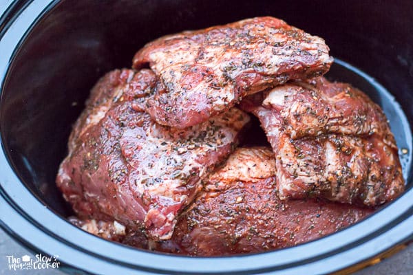 Raw baby back ribs in slow cooker