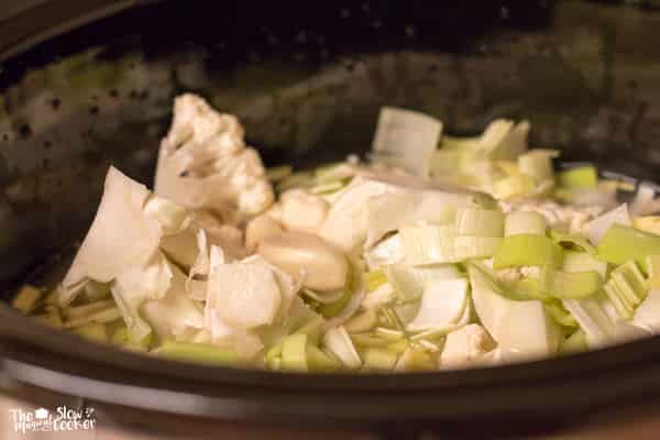 cauliflower and leeks in chicken broth in slow cooker.
