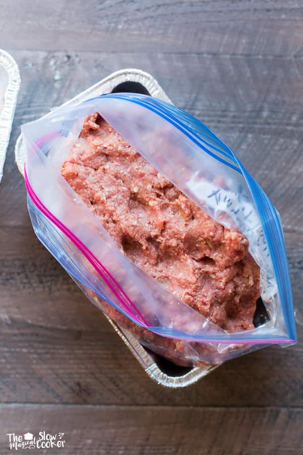 raw meat loaf mix in ziplock mag in metal pan.