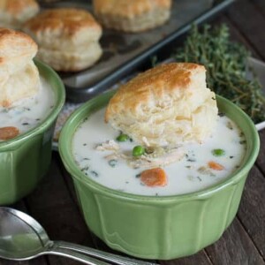 two bowls of chicken pot pie soup in green bowls
