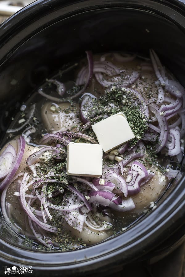 chicken breasts, butter, onions and butter in slow cooker