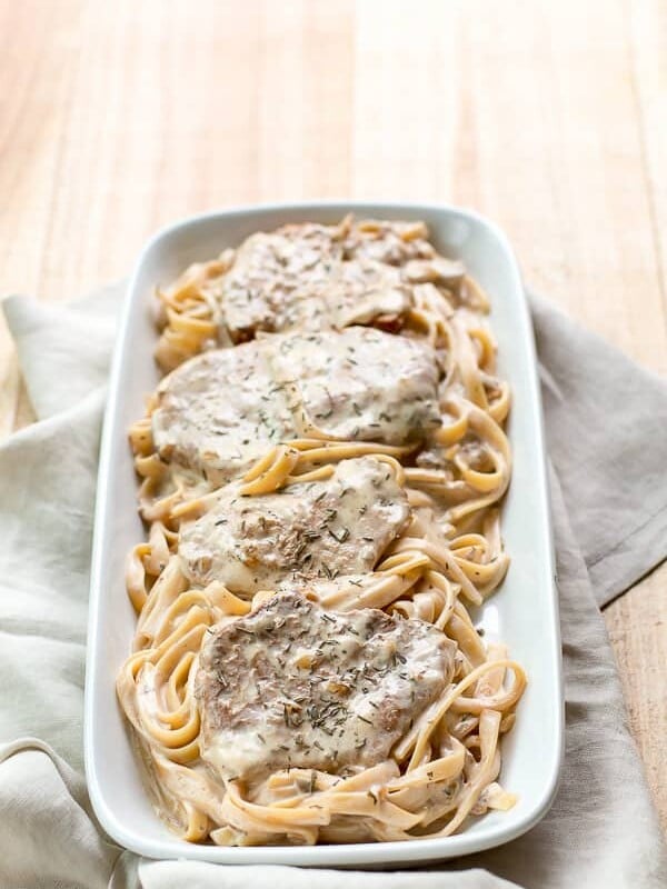 platter of pork chops on noodles