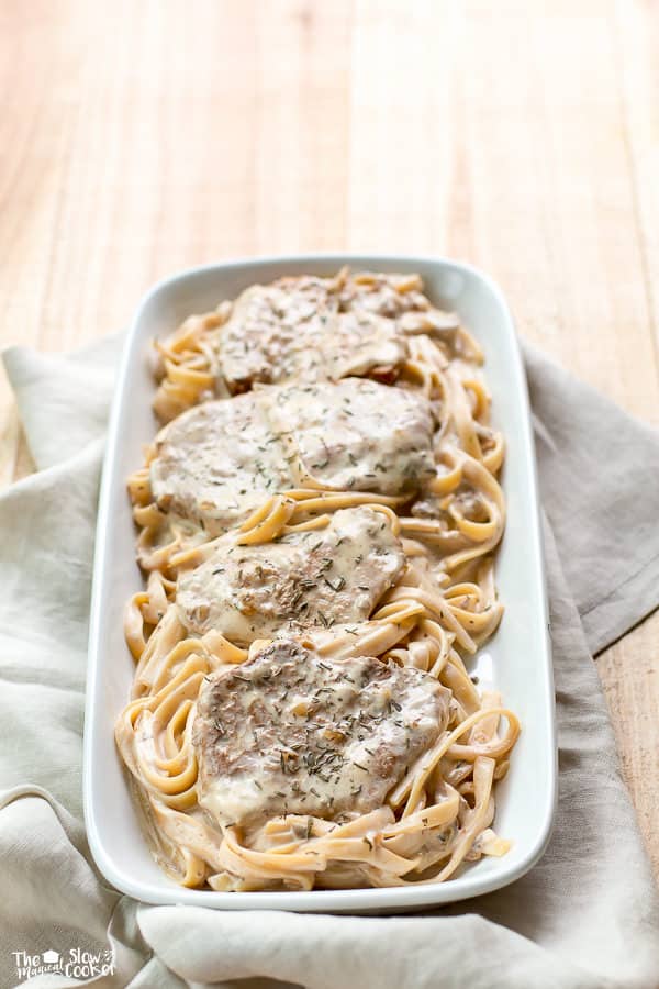 platter of pork chops on noodles