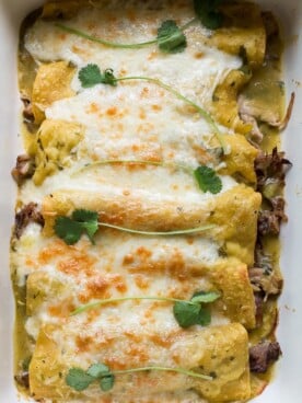 pork enchiladas in green sauce with cheese on top (9 by 13 pan)