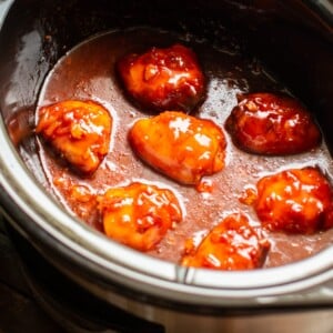 close up of chicken in apricot chicken in slow cooker
