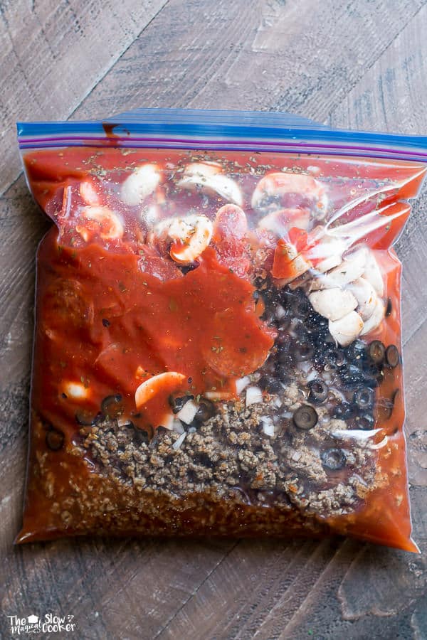 ziplock bag with pepperoni, olives, mushrooms, ground beef and marinara