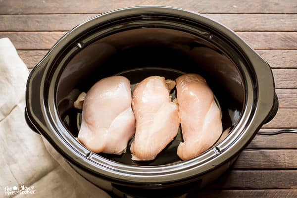 Three chicken breasts in slow cooker.