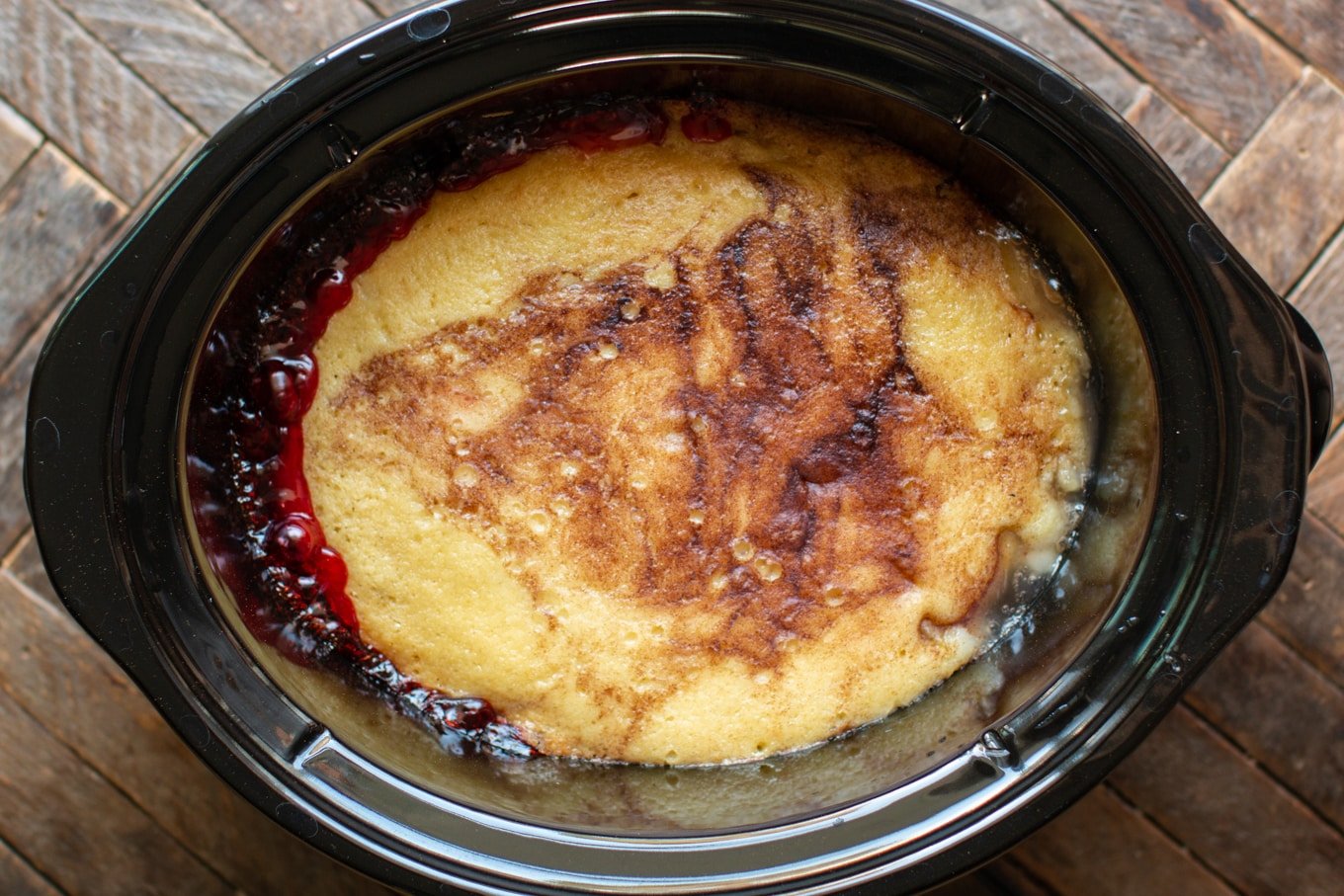 Cooked His and Hers cobbler with cake topping with cinnamon and sugar on top.