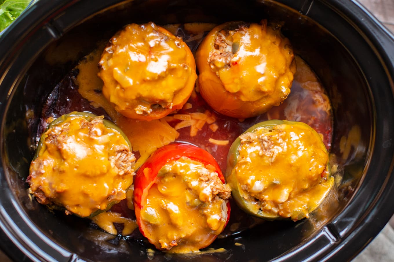 Close up of taco meatloaf stuffed peppers in slow cooker