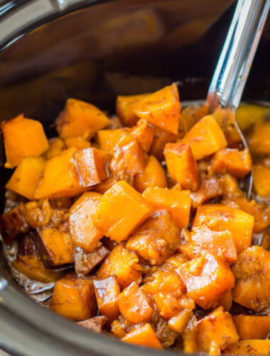 close up of cooked cubed butternut squash in the slow cooker.