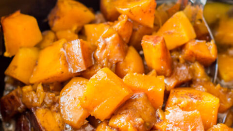 close up of cooked cubed butternut squash in the slow cooker.