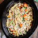 Garlic butter chicken pasta with carrots and peas in a slow cooker