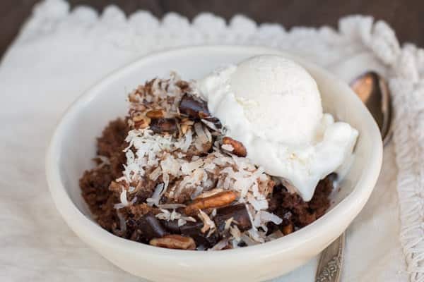 bowl of german chocolate spoon cake with ice cream on top.