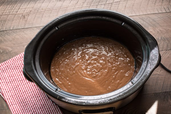 german chocolate cake batter in a slow cooker.