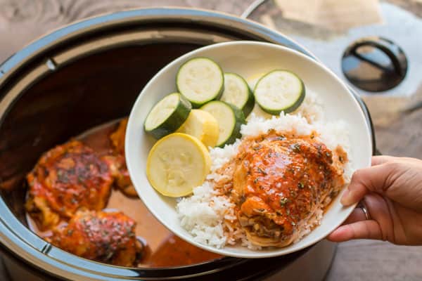 Slow Cooker Hot Chicken plated with zucchini and rice.