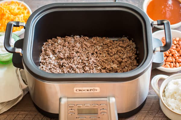 A bowl of food sitting on a table, with Slow cooker